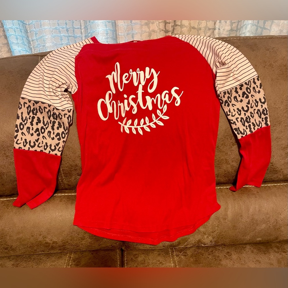 Size small red Christmas shirt withh leopard detail on sleeves.